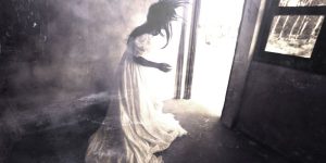 scary ghost woman floating in abandoned house