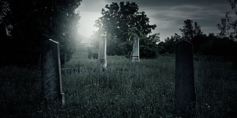 eerie graveyard in darkness
