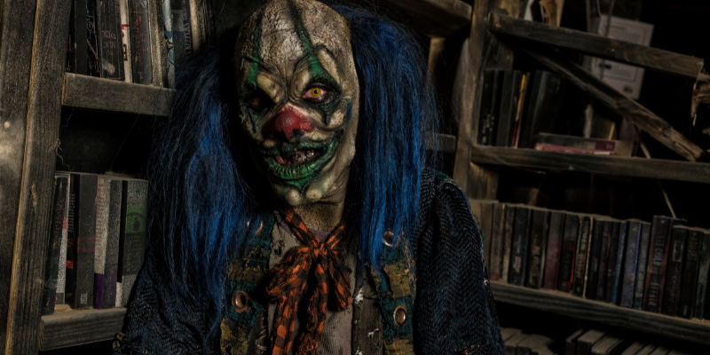 scary-clown-with-blue-hair-in-library